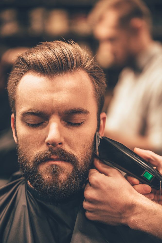 Man getting haircut Safari Barbers Grayshott